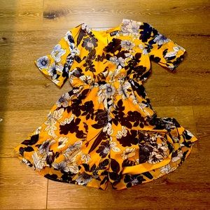 Yellow jumper with flowers on it